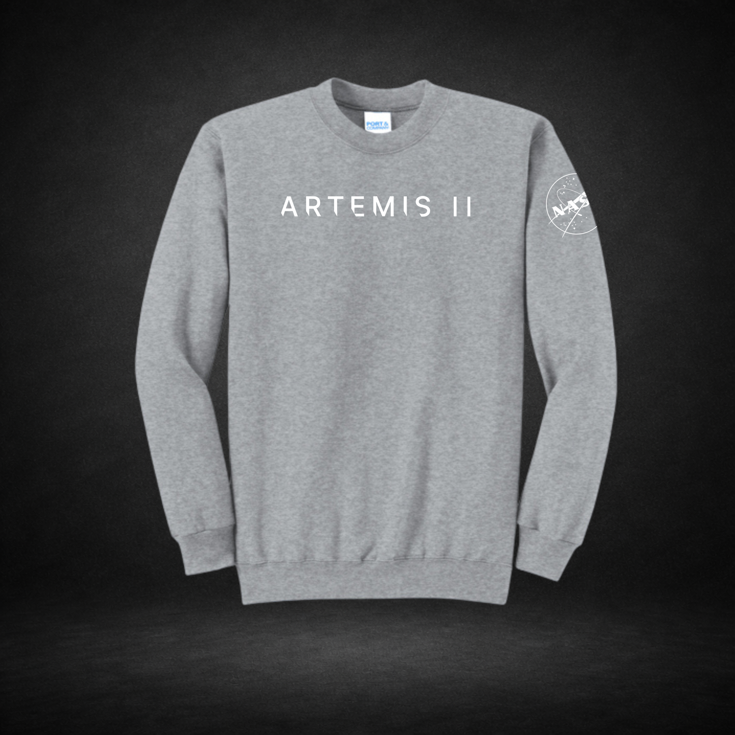 Gray sweatshirt with 'ARTEMIS II' text and NASA logo on a dark background