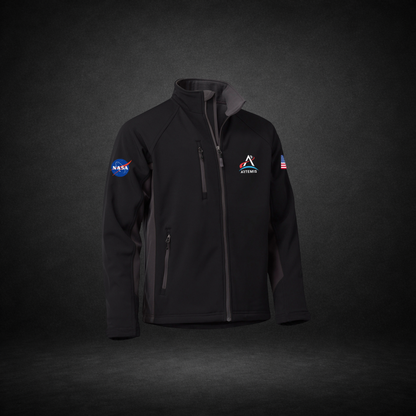 Black and gray jacket with NASA Meatball, Artemis Logo, and American Flag on a dark background