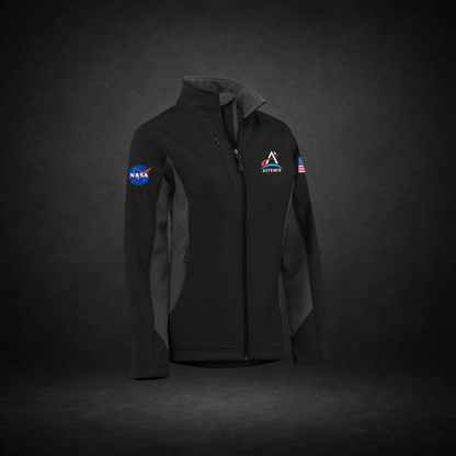 Black and gray jacket with NASA Meatball, Artemis Logo, and American Flag on a dark background