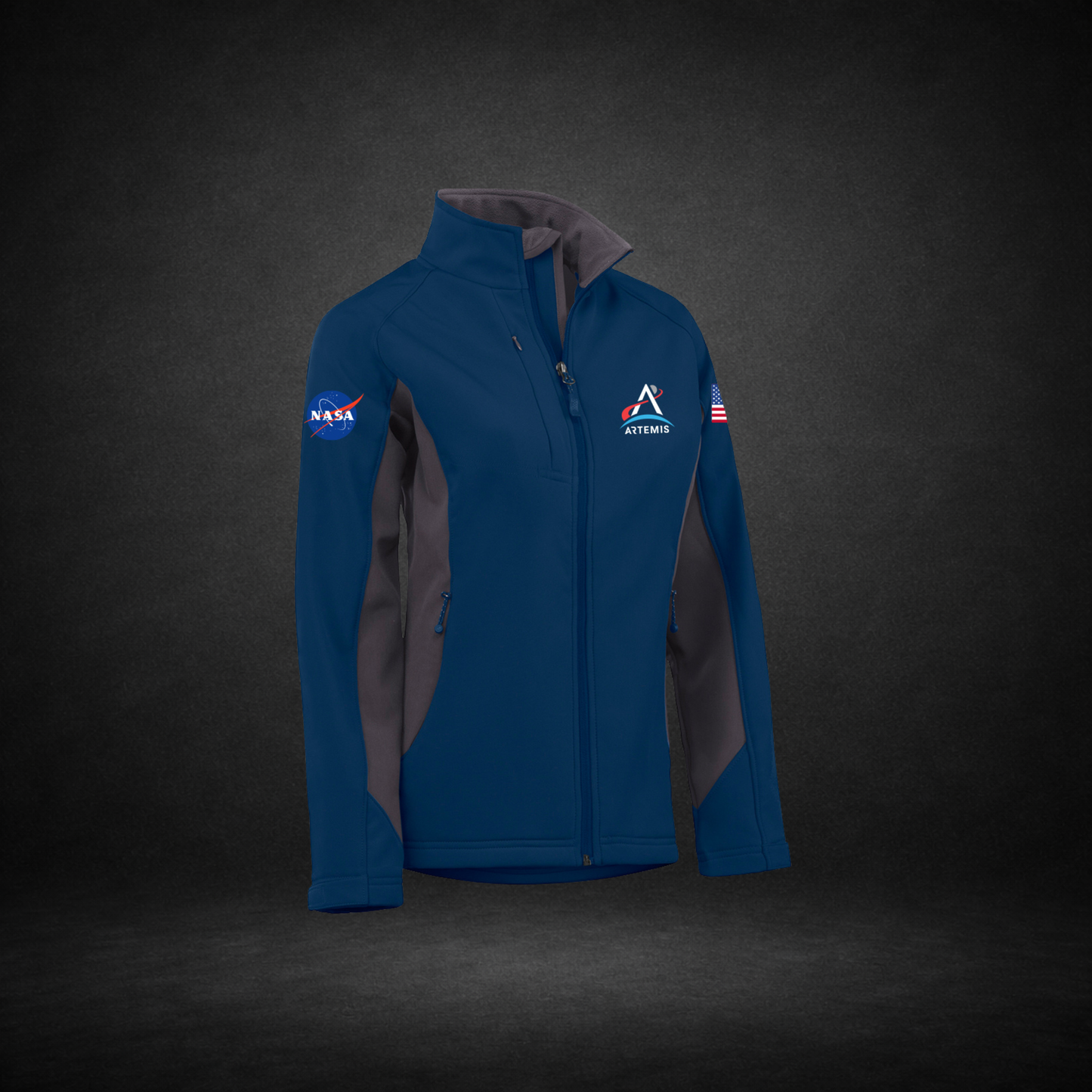Blue and Gray jacket with NASA Meatball, Artemis Logo, and American Flag on a dark background