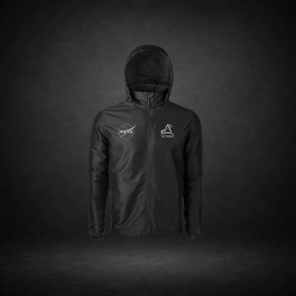 Black windbreaker with NASA Meatball and Artemis logos on a dark background