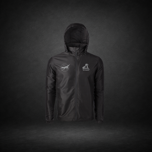 Black windbreaker with NASA Meatball and Artemis logos on a dark background