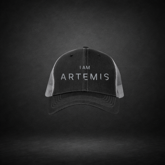 Black cap with 'I AM ARTEMIS' text on a dark background